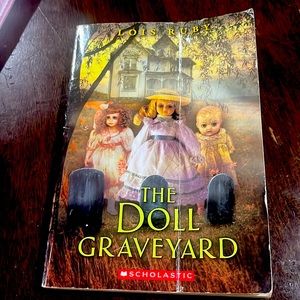 A book called The Doll Graveyard from Scholastic by Lois Ruby, Reading level 5